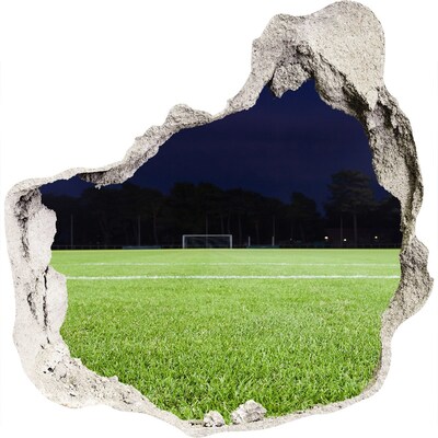 Trompe l'oeil buco nel muro Campo da calcio di notte
