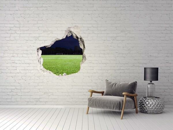 Trompe l'oeil buco nel muro Campo da calcio di notte