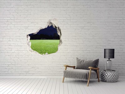Trompe l'oeil buco nel muro Campo da calcio di notte