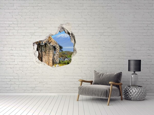 Adesivo effetto buco nel muro Lo sguardo appiccicoso di un leopardo