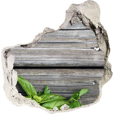 Adesivo effetto buco nel muro Un muro danneggiato con pavimento in legno