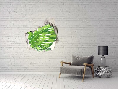 Trompe l'oeil buco nel muro Monstera verde in una buca di cemento