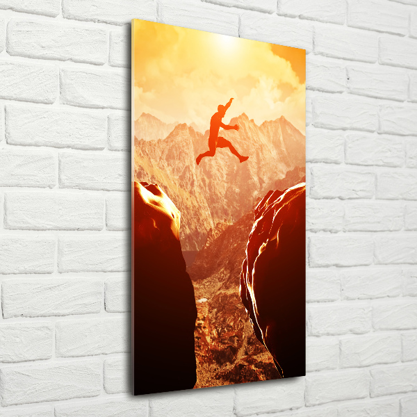 Quadro stampa su vetro acrilico verticale Salta oltre l'abisso