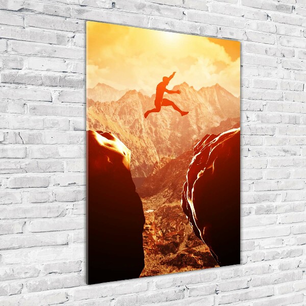 Quadro stampa su vetro acrilico verticale Salta oltre l'abisso