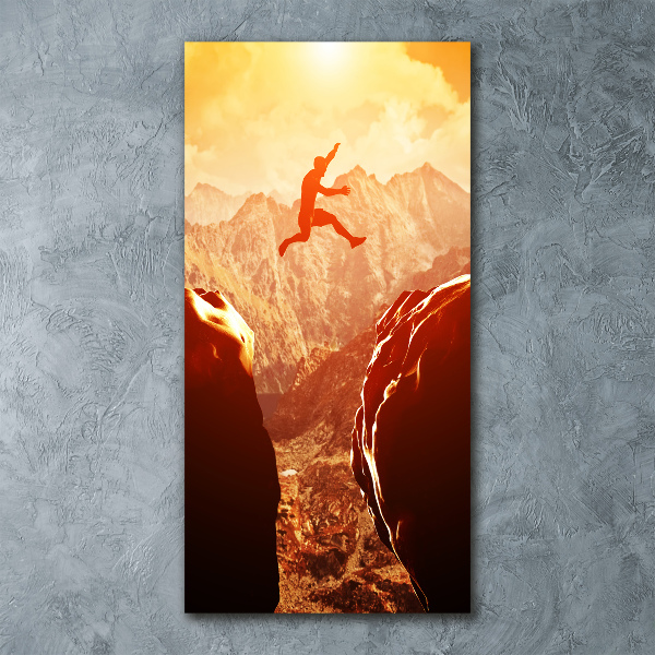 Quadro stampa su vetro acrilico verticale Salta oltre l'abisso