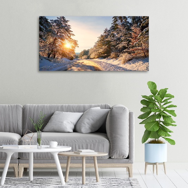 Quadro su tela Una strada nella foresta in inverno