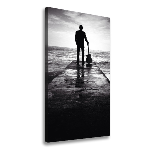 Quadro foto su tela verticale Chitarrista sul molo