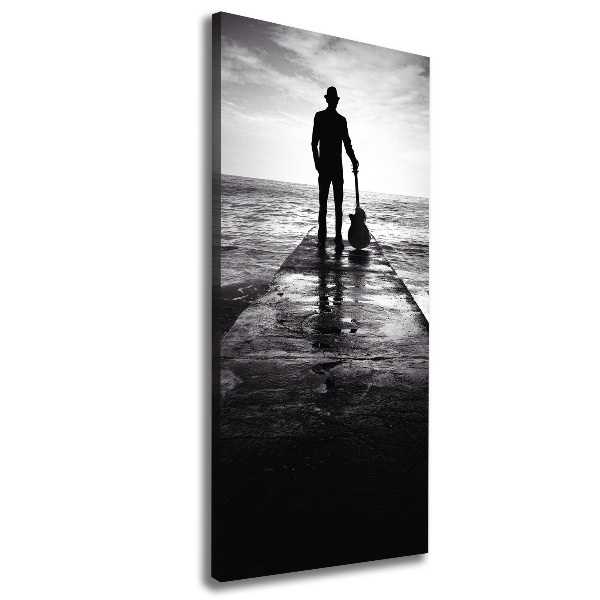 Quadro foto su tela verticale Chitarrista sul molo