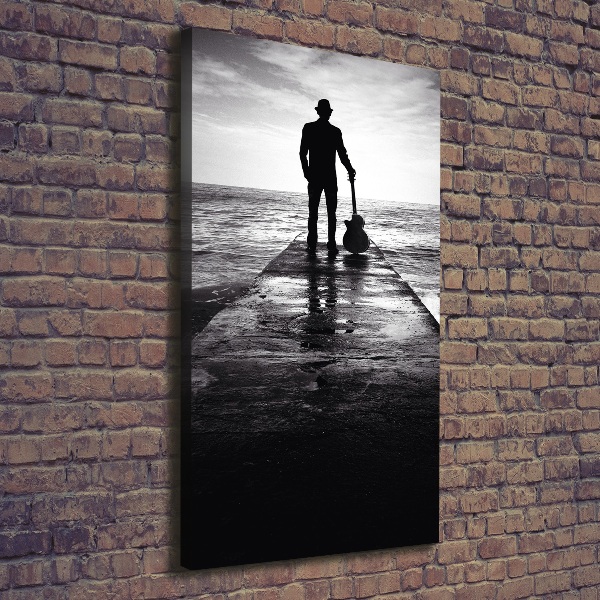 Quadro foto su tela verticale Chitarrista sul molo