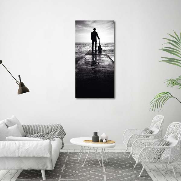 Quadro foto su tela verticale Chitarrista sul molo