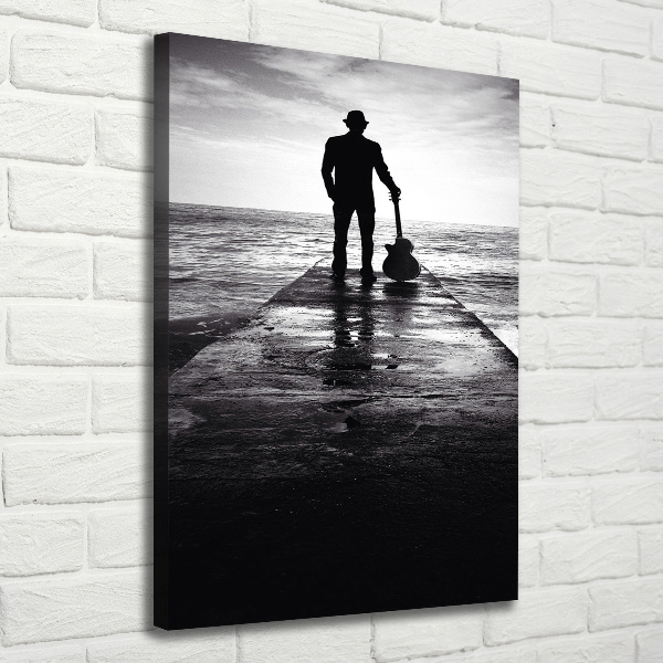 Quadro foto su tela verticale Chitarrista sul molo