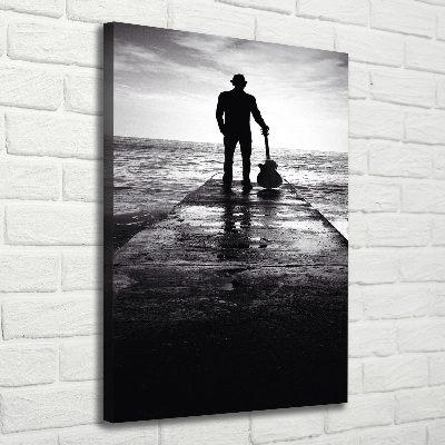 Quadro foto su tela verticale Chitarrista sul molo