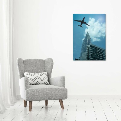 Quadro su tela canvas verticale Un aereo sopra la città