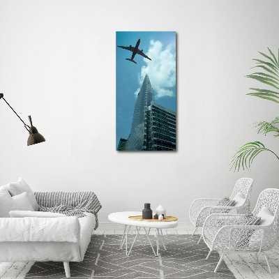 Quadro su tela canvas verticale Un aereo sopra la città