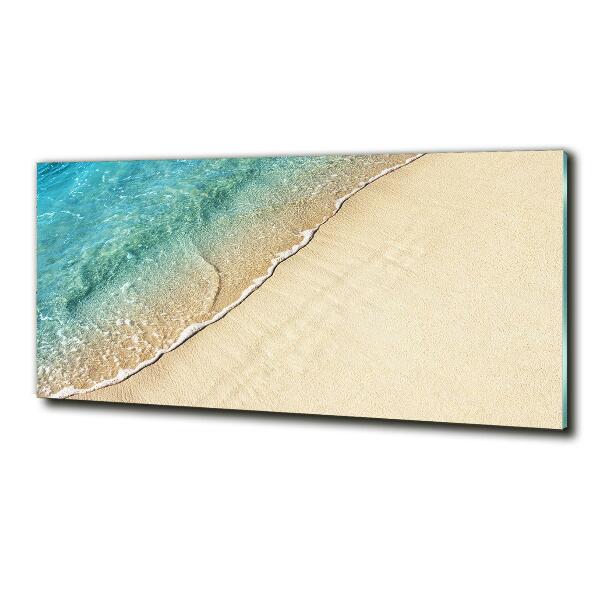 Quadro vetro Un'onda sulla spiaggia