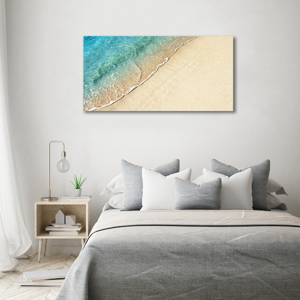 Quadro vetro Un'onda sulla spiaggia