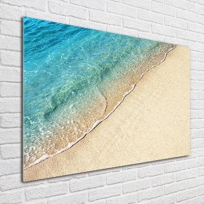Quadro vetro Un'onda sulla spiaggia