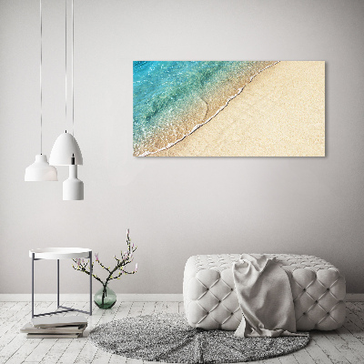 Quadro vetro Un'onda sulla spiaggia