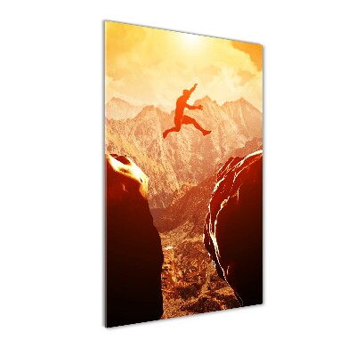 Quadro stampa su vetro verticale Salta oltre l'abisso