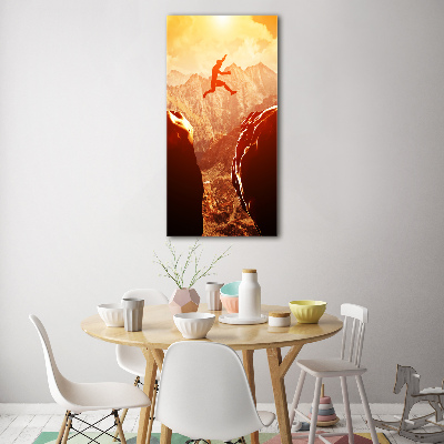 Quadro stampa su vetro verticale Salta oltre l'abisso