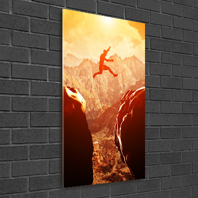 Quadro stampa su vetro verticale Salta oltre l'abisso