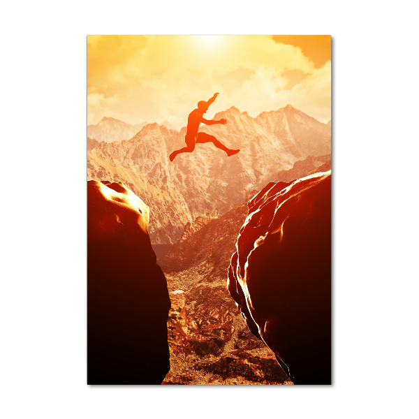 Quadro stampa su vetro verticale Salta oltre l'abisso