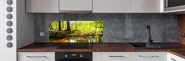 Rivestimento parete cucina con motivo «Raggi di sole nella foresta»