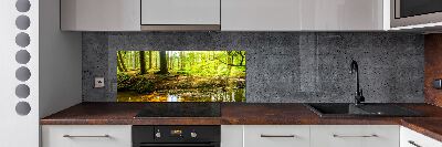 Rivestimento parete cucina con motivo «Raggi di sole nella foresta»