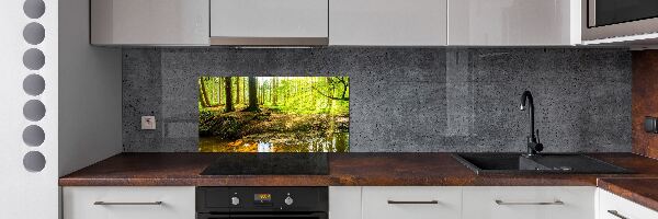Rivestimento parete cucina con motivo «Raggi di sole nella foresta»