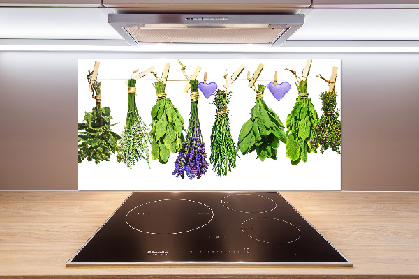 Rivestimento parete cucina con motivo di erbe aromatiche disposte su un filo