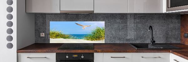 Rivestimento parete cucina con decorazione raffigurante un gabbiano sulla spiaggia