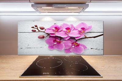 Pannello paraschizzi cucina con motivo di orchidea su sfondo effetto legno