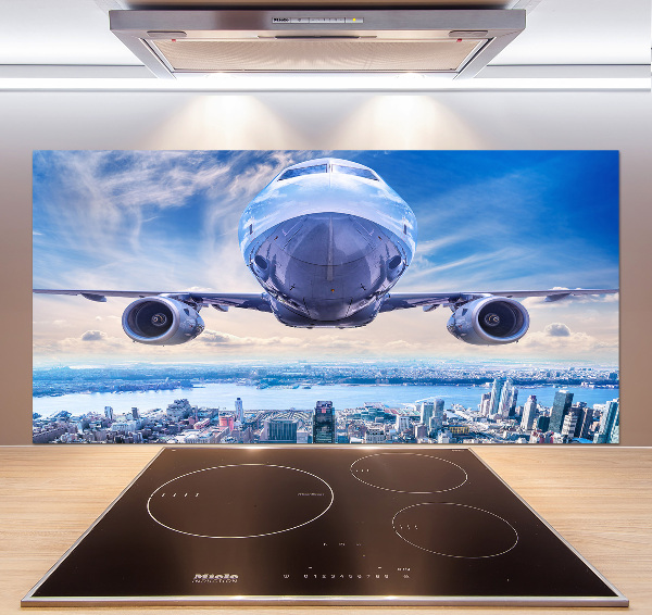 Pannello paraschizzi cucina con stampa raffigurante un aereo sopra la città
