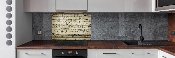 Pannello retrocucina con decorazione a motivo di note sul pentagramma