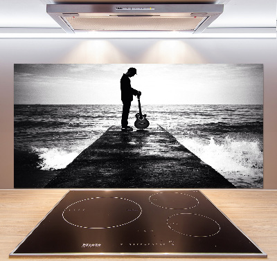 Rivestimento parete cucina con stampa raffigurante un chitarrista sul molo