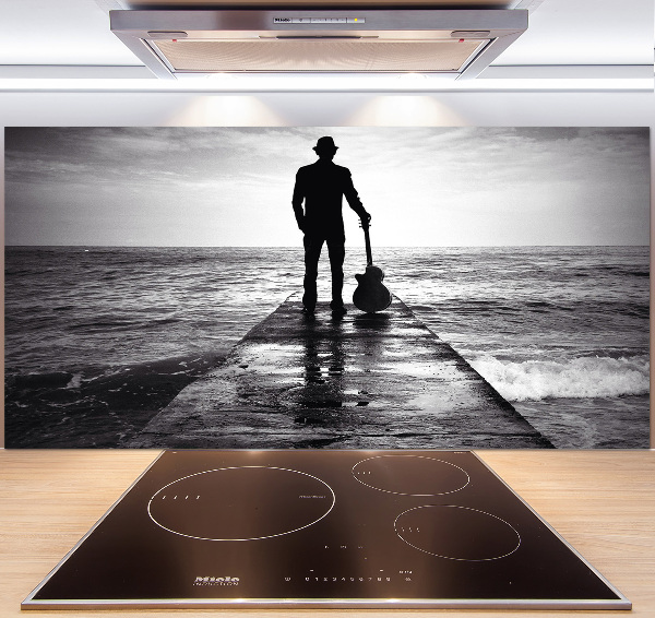 Pannello retrocucina con stampa raffigurante un chitarrista sul molo