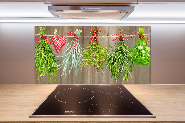 Rivestimento parete cucina con motivo di erbe aromatiche su un filo