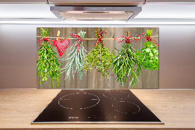 Rivestimento parete cucina con motivo di erbe aromatiche su un filo