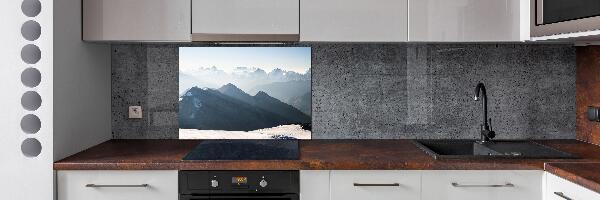 Rivestimento parete cucina con decorazione a motivo di cime montuose