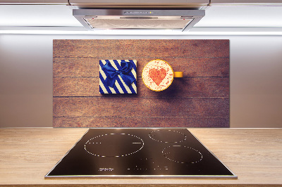 Pannello retrocucina con motivo a tema caffè e accompagnato da un regalo