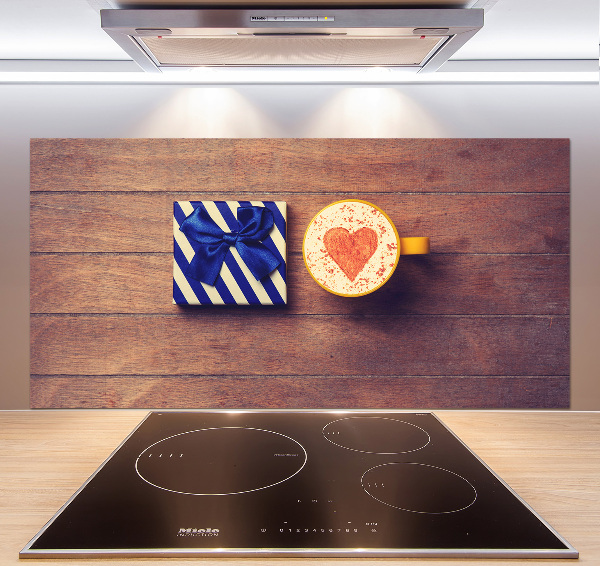 Pannello retrocucina con motivo a tema caffè e accompagnato da un regalo