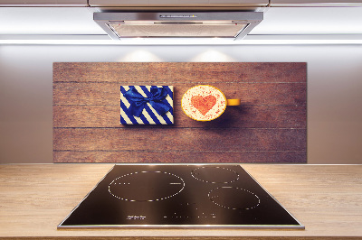 Pannello retrocucina con motivo a tema caffè e accompagnato da un regalo