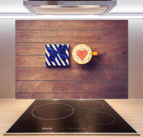 Pannello retrocucina con motivo a tema caffè e accompagnato da un regalo