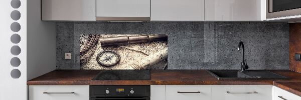 Rivestimento parete cucina con motivo a bussola, mappa e lente d'ingrandimento
