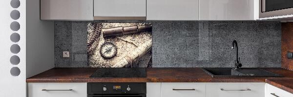 Rivestimento parete cucina con motivo a bussola, mappa e lente d'ingrandimento