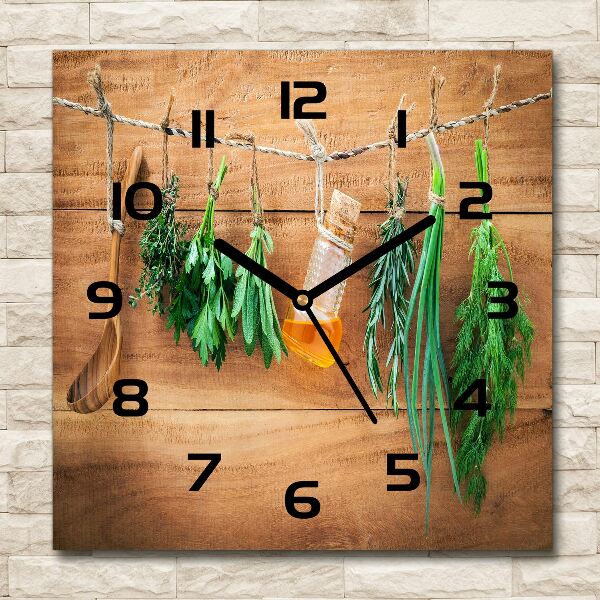 Orologio da parete quadrato con decorazione a motivo di erbe aromatiche su un filo