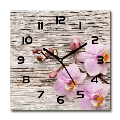 Orologio quadrato con motivo di orchidea su sfondo effetto legno