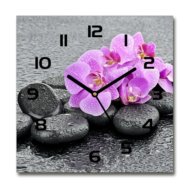 Orologio quadrato con motivi di pietre e orchidea