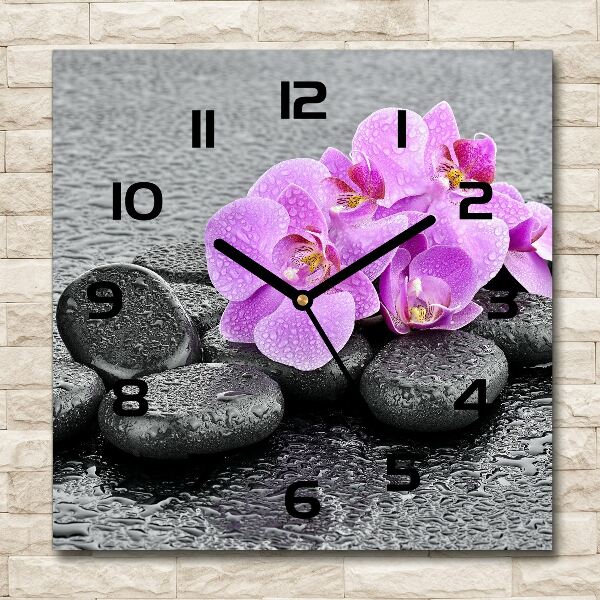 Orologio quadrato con motivi di pietre e orchidea