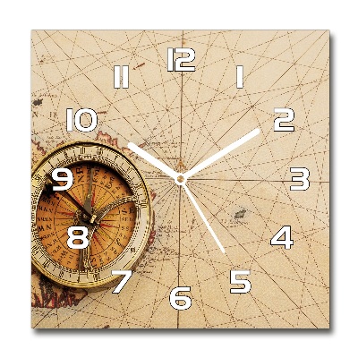 Orologio quadrato con quadrante decorato con una bussola su una mappa